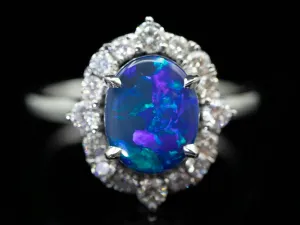 18K White Gold Black Opal Oval and Diamond Halo Ring