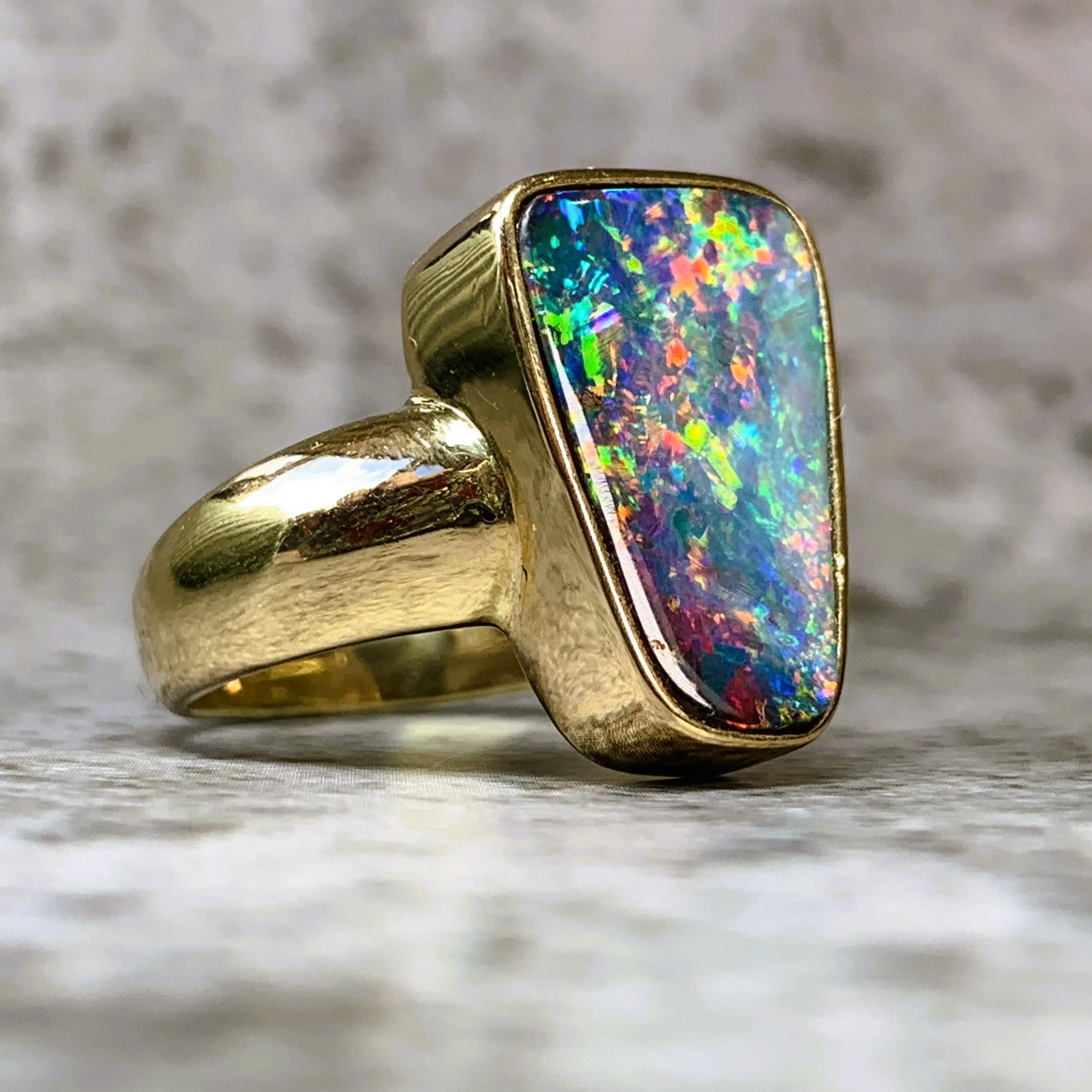 18kt Yellow Gold 5.42ct Queensland Boulder Fire Opal bezel set ring