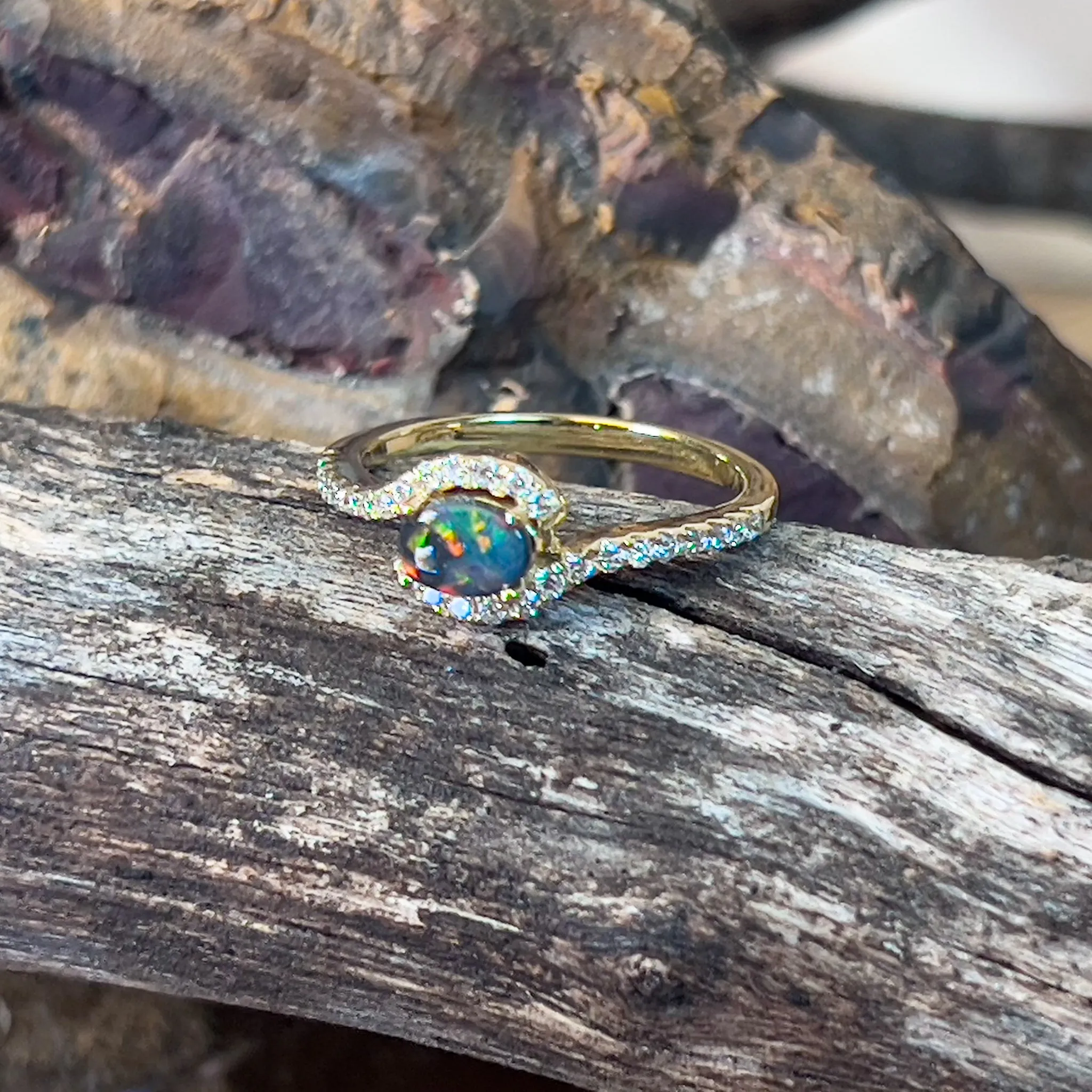 18kt Yellow Gold Black Opal 0.26ct and Diamond cross over ring