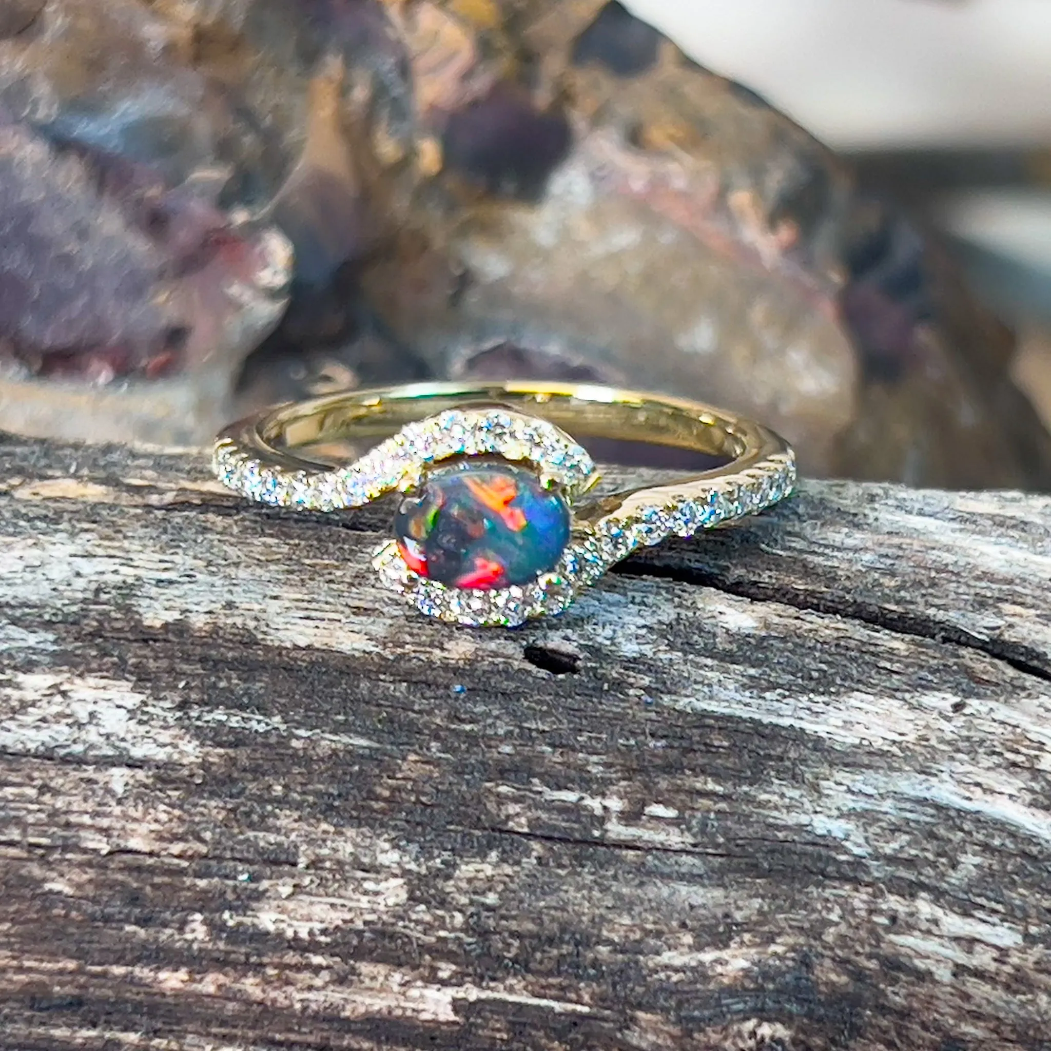 18kt Yellow Gold Black Opal 0.26ct and Diamond cross over ring