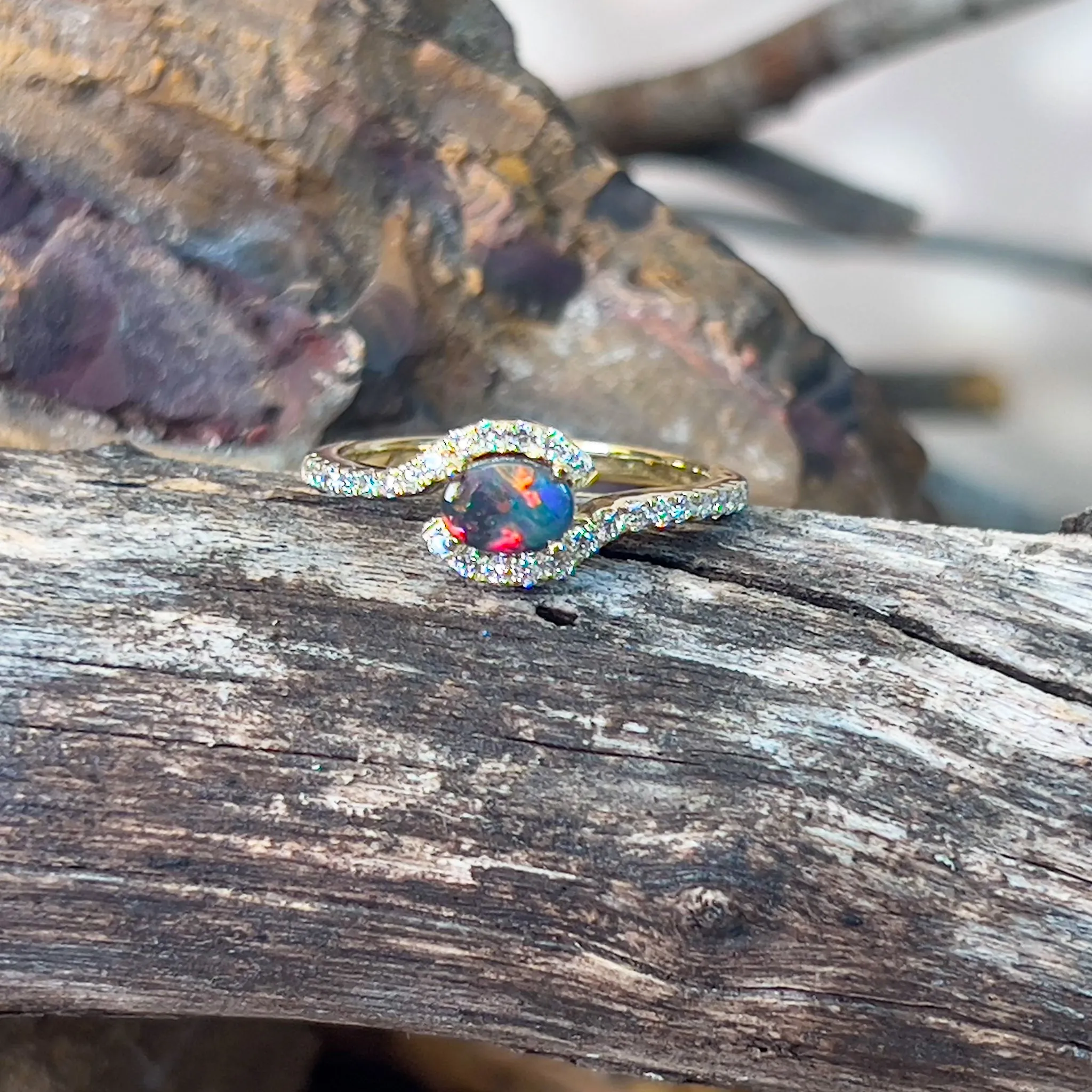 18kt Yellow Gold Black Opal 0.26ct and Diamond cross over ring