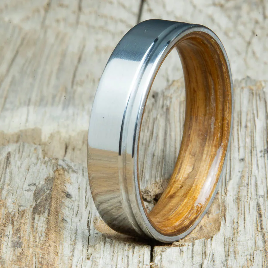 Bentwood whiskey barrel wood and 6mm polished offset groove titanium wedding band