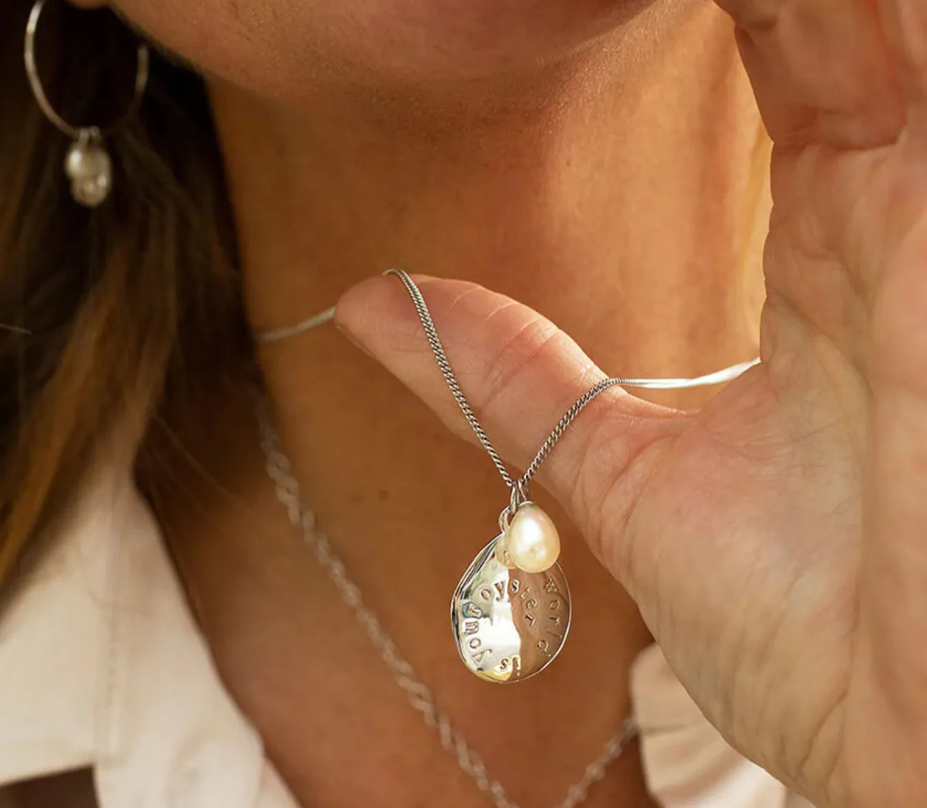Claudia Bradby Silver pearl the world is your oyster pendant